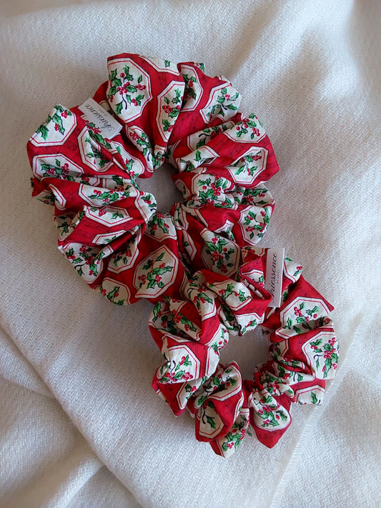 front view of Christmas red cotton upcycled scrunchies laying down size comparison