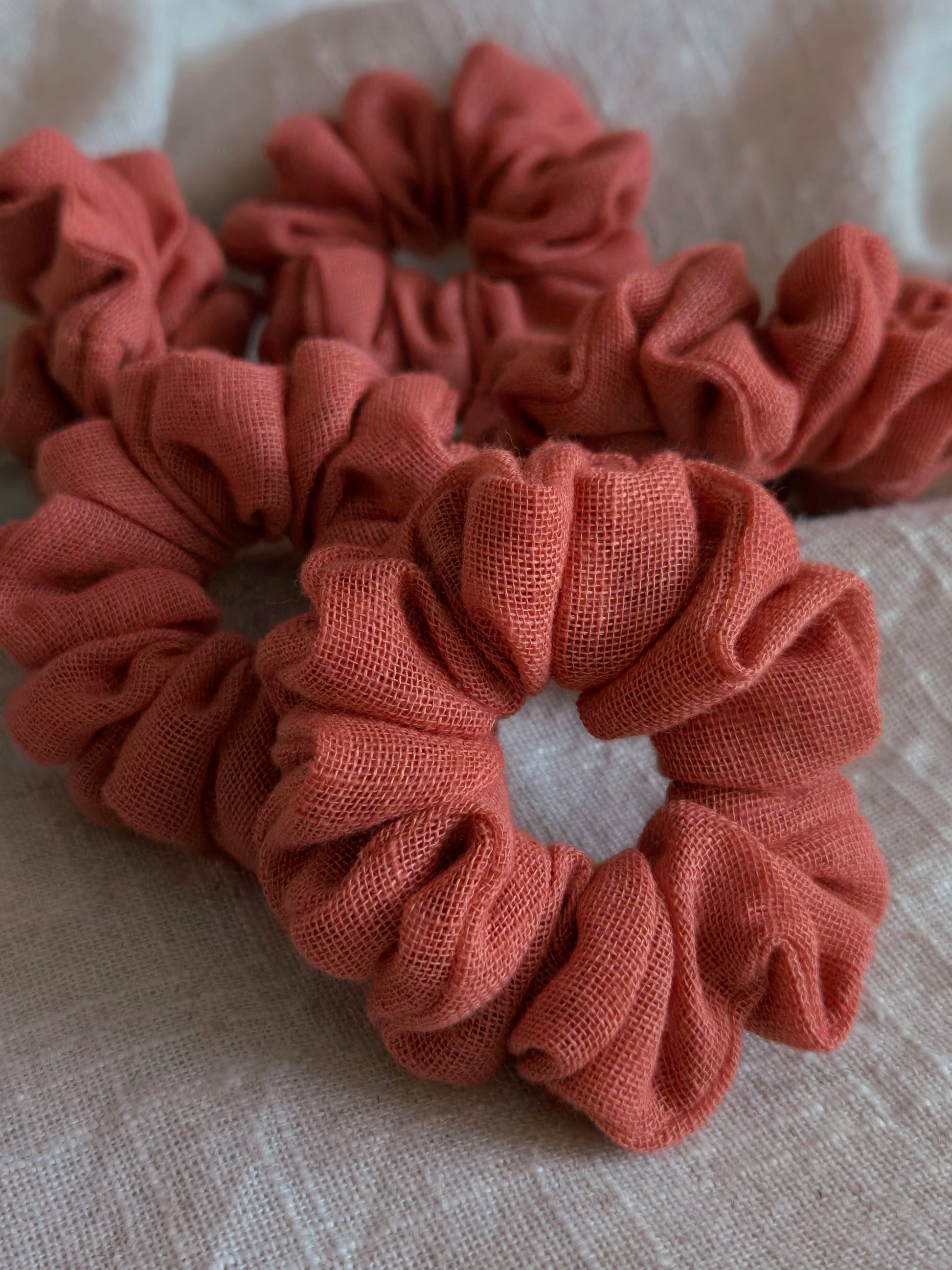 close up of terracotta linen upcycled scrunchies