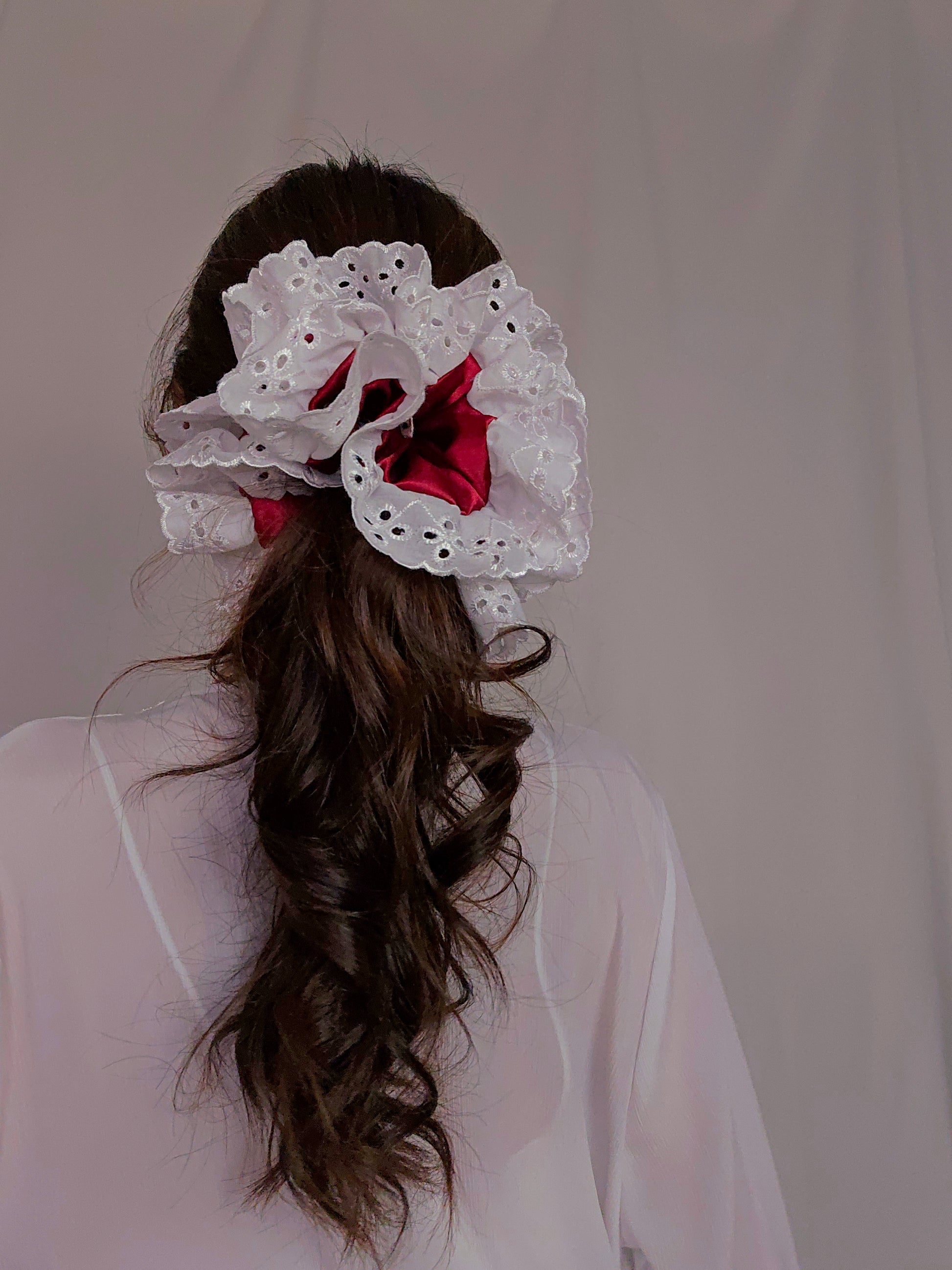 back view of white lace red satin upcycled scrunchie on model