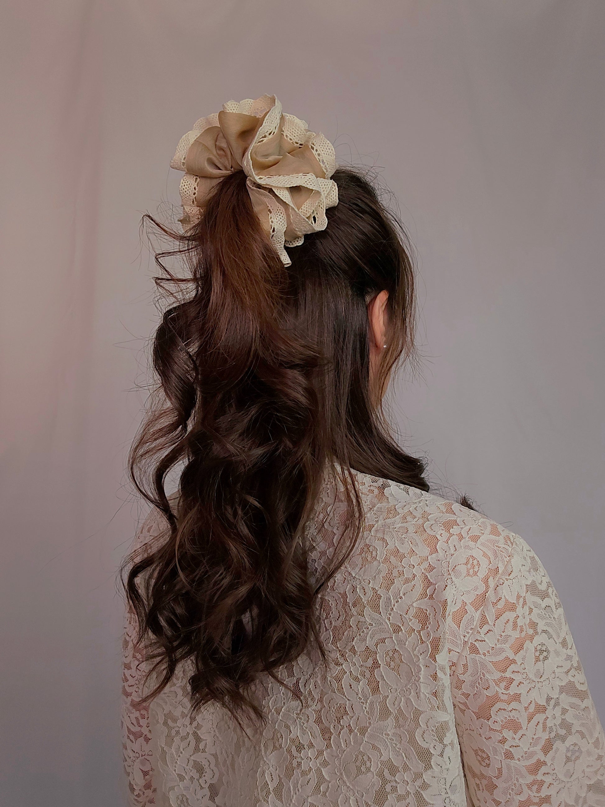 back view of beige lace upcycled scrunchie on model