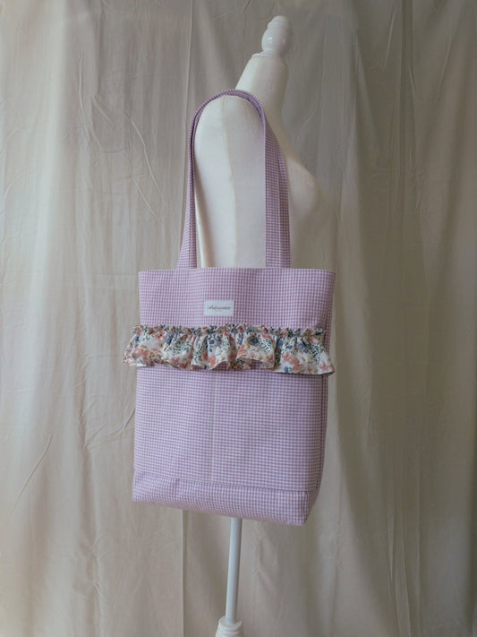 front view of purple gingham ruffle tote bag on mannequin