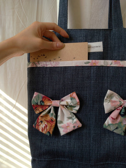 front view of exterior pockets on cotton bow navy upcycled tote bag