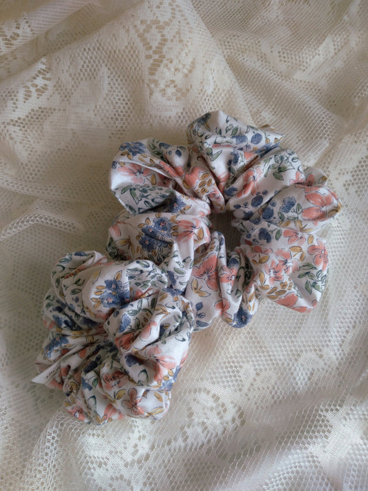 front view of floral cotton upcycled scrunchies laying down size comparison