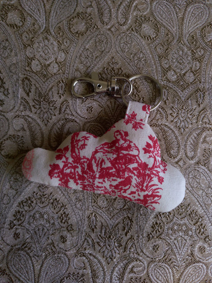 front view of colonial toile cotton upcycled cloud keychain laying flat