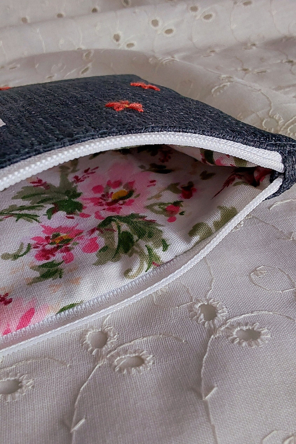 inside view of hand embroidered daisy upcycled pouch