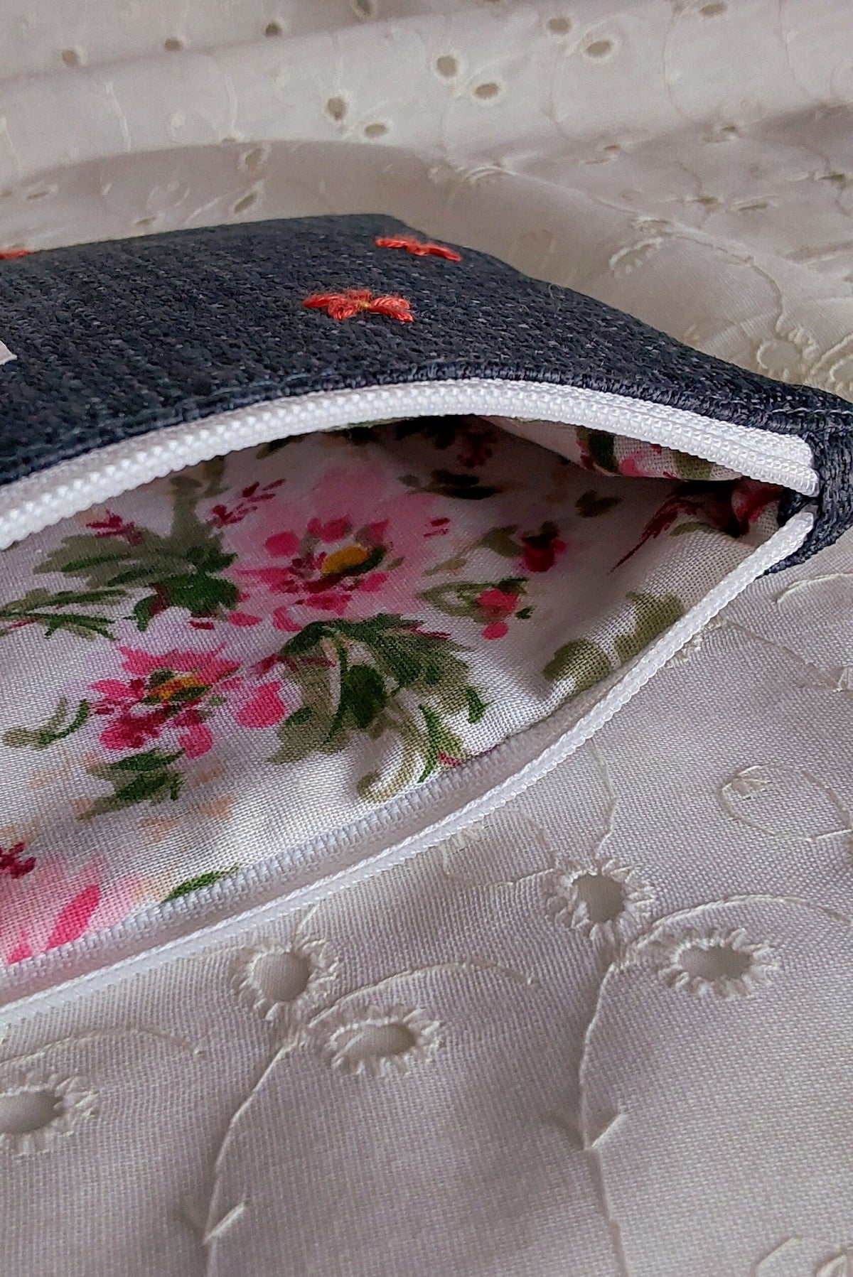 inside view of hand embroidered daisy upcycled pouch