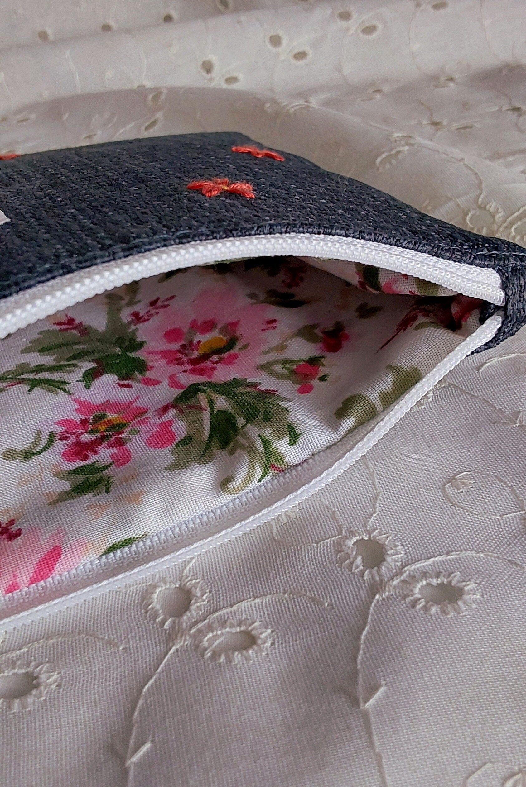 inside view of hand embroidered daisy upcycled pouch