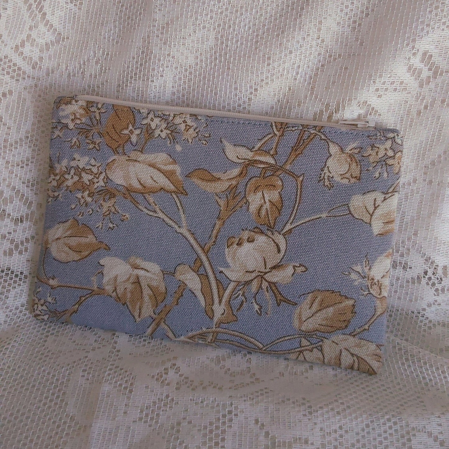 back view of floral blue beige upcycled pouch