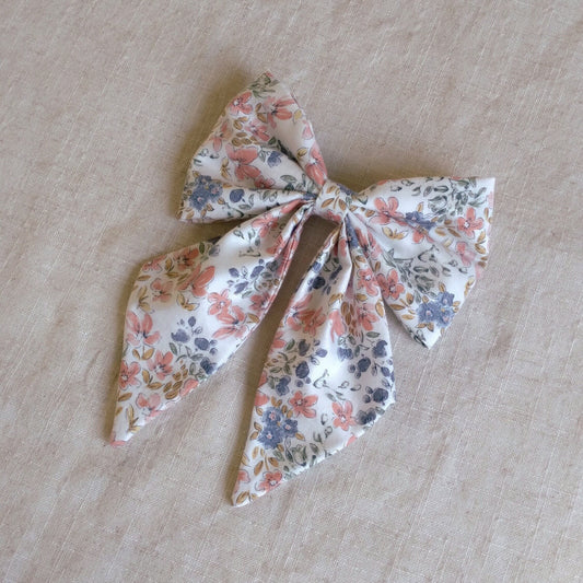 front view of floral cotton upcycled hair bow laying flat