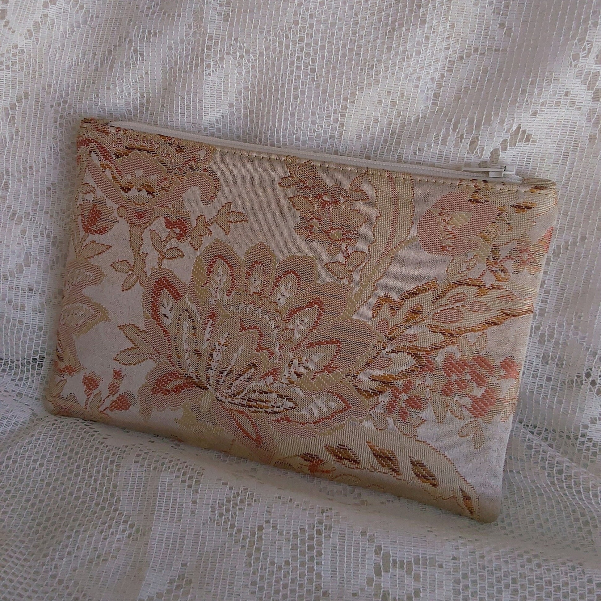 back view of gold jacquard upcycled pouch