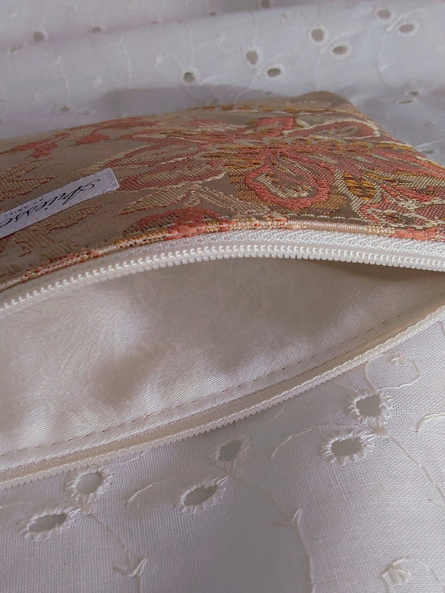 inside view of gold jacquard upcycled pouch