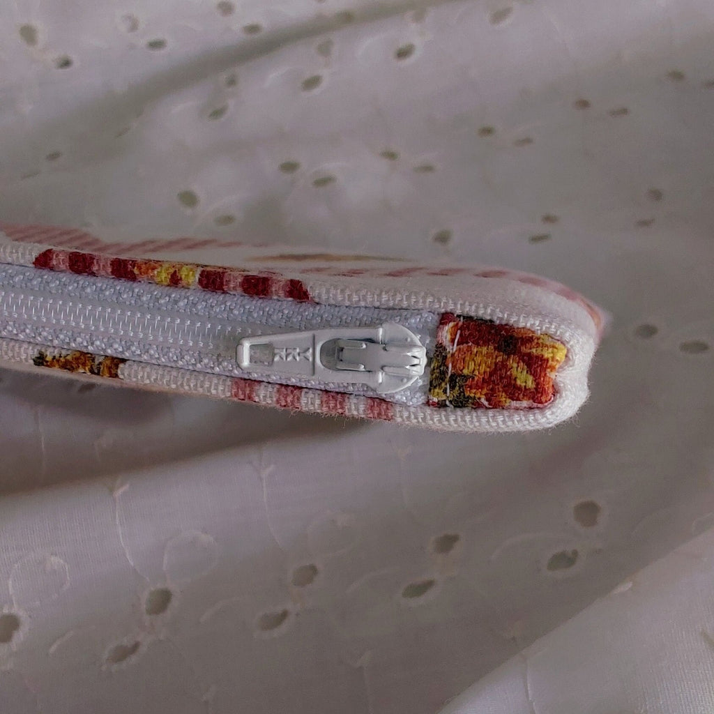 close up of zipper on rooster floral gingham red white cotton upcycled pouch